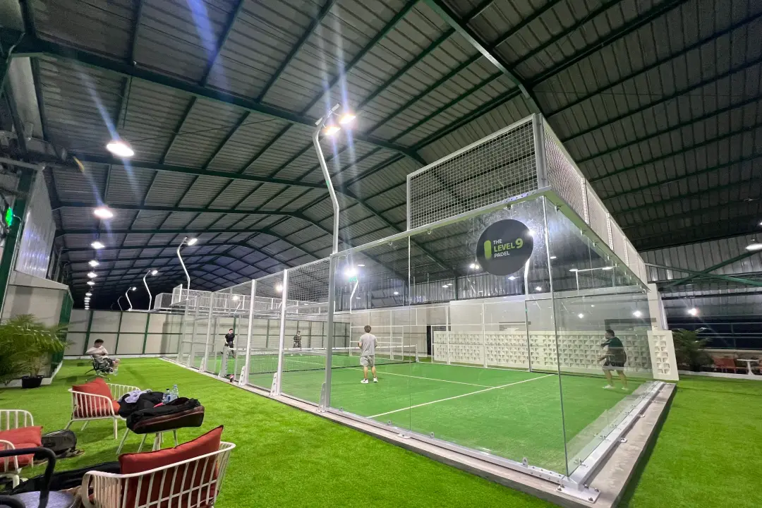 Turf lounge beside a court on the rooftop